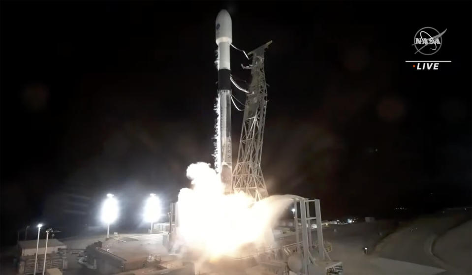 In this image made from video provided by NASA, a SpaceX rocket carrying the Surface Water and Ocean Topography satellite lifts off from Vandenberg Space Force Base in California, Friday, Dec. 16, 2022. (NASA via AP)