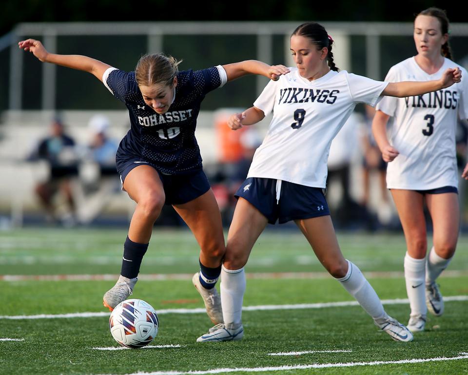 East Bridgewater's Sarah Silvia steps in to clear the ball away from Cohasset's Tess Barrett during second half action of their game at Cohasset High School on Wednesday, Sept. 27, 2023. Cohasset would go on to win 4-1.