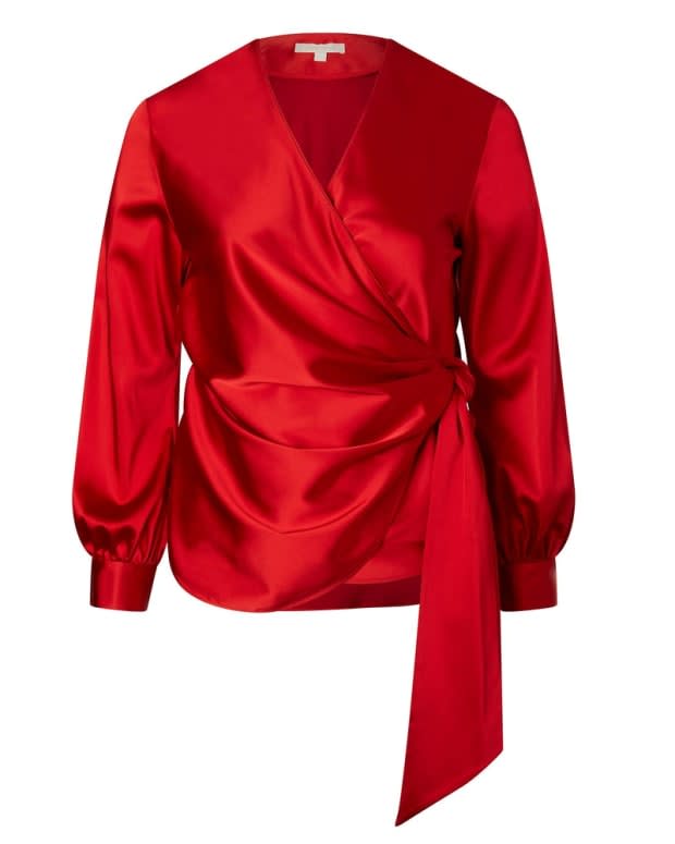 <p>Jonathan Simkhai Silk Top, $545, <a href="https://11honore.com/collections/plus-size-tops/products/jonathan-simkhai-red-exclusive-satin-tie-front-wrap-top" rel="nofollow noopener" target="_blank" data-ylk="slk:available here;elm:context_link;itc:0;sec:content-canvas" class="link ">available here</a> (sizes 14-20).</p>