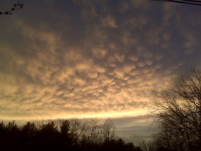 <a href="http://www.flickr.com/photos/mstyne/4498567422/" rel="nofollow noopener" target="_blank" data-ylk="slk:Mammatus Clouds;elm:context_link;itc:0;sec:content-canvas" class="link ">Mammatus Clouds</a>. Spied over my neighbors house as I returned from a hard day's work. This photo was taken on April 6, 2010 in Sand Lake, New York, US, using a RIM BlackBerry 8330.