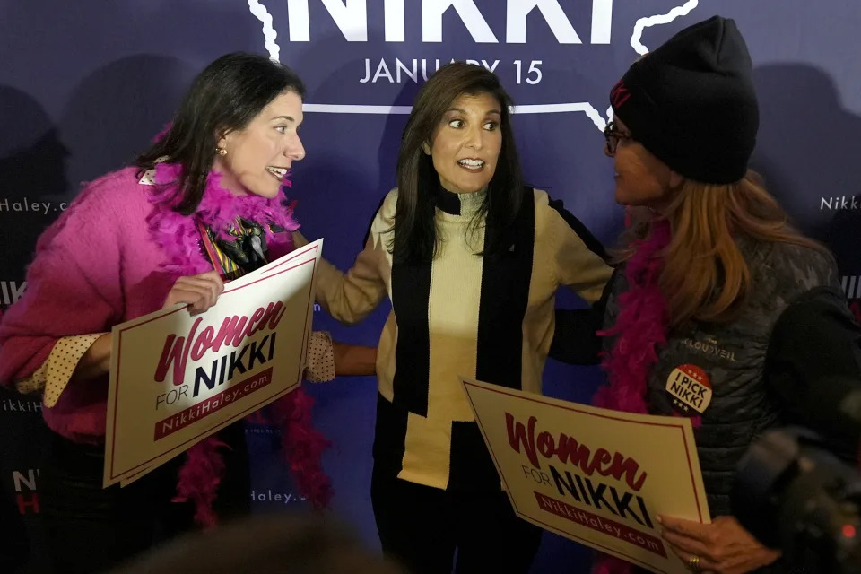 Republican presidential candidate former UN Ambassador Nikki Haley, center, greets audience members at a campaign event at Jethro's BBQ in Ames, Iowa, Sunday, Jan. 14, 2024. (AP Photo/Carolyn Kaster)