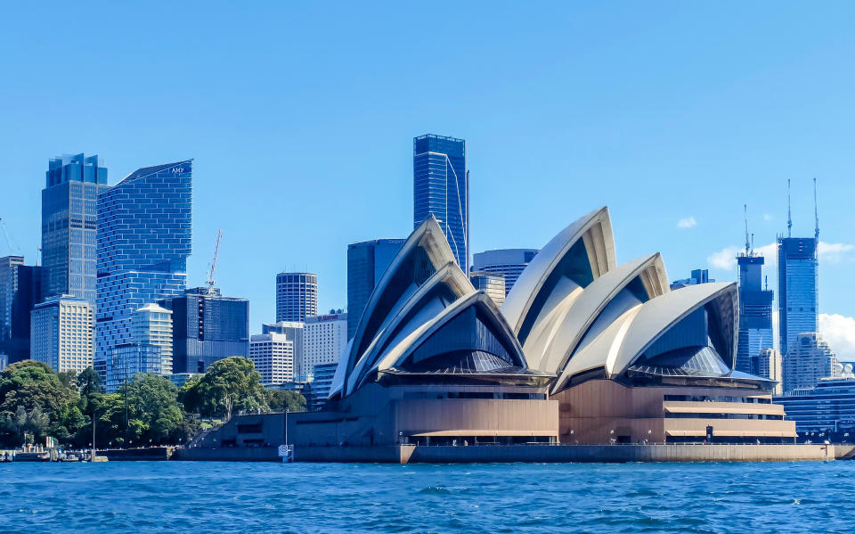 The Sydney Opera House in Australia is seen from the water. 