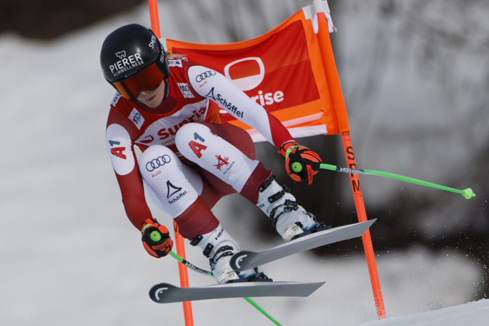 Austria's Cornelia Huetter speeds down the course during an alpine ski, women's World Cup downhill race, in Crans Montana, Switzerland, Friday, Feb. 16, 2024. (AP Photo/Giovanni Pizzato)