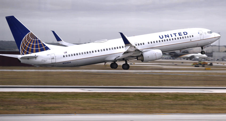 A united airlines flight takes off.