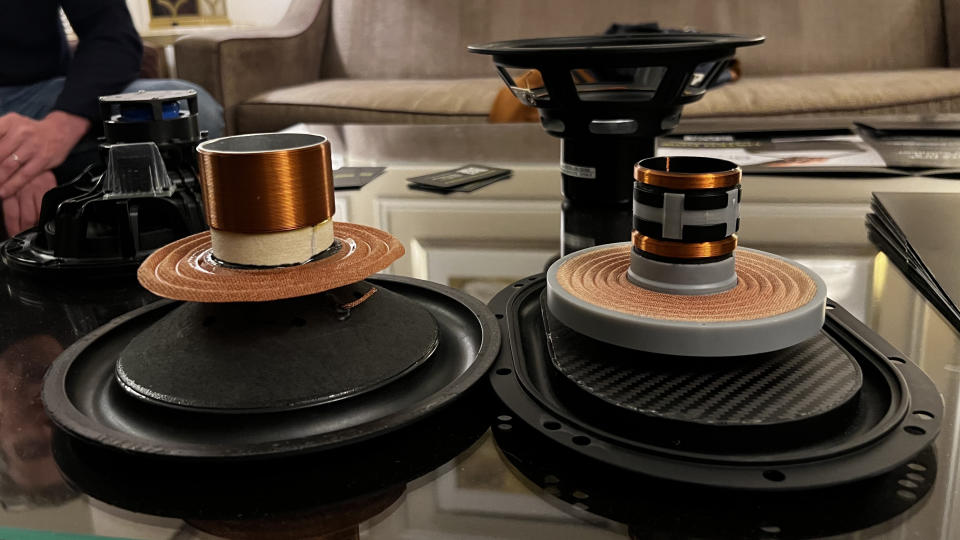 The Brane X speaker's subwoofer unit next to a regular subwoofer unit, showing a different magnet configuration