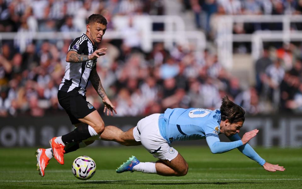 Jack Grealish of Manchester City is challenged by Kieran Trippier of Newcastle United during the Premier League match between Newcastle United FC and Manchester City FC