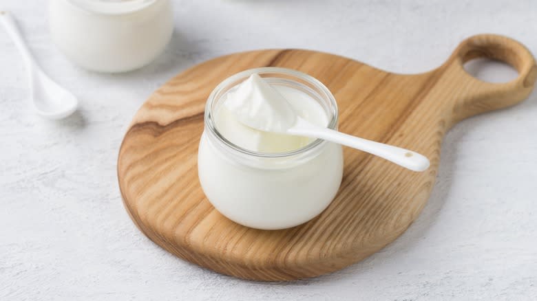 greek yogurt on wooden board