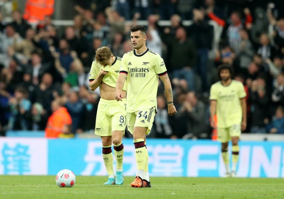 A dejected Granit Xhaka walks away after Gabriel’s own goal  (Reuters)