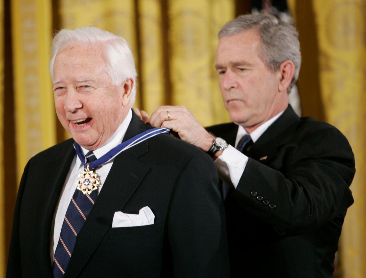 President George W. Bush, right, bestows the Presidential Medal of Freedom to author and historian David McCullough during a ceremony in the East Room of the White House in Washington, Dec. 15, 2006. McCullough, the Pulitzer Prize-winning author whose lovingly crafted narratives on subjects ranging from the Brooklyn Bridge to Presidents John Adams and Harry Truman made him among the most popular and influential historians of his time, died Sunday in Hingham. He was 89.