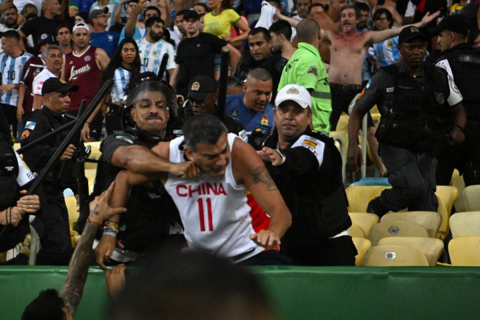 Police were seen punching supporters and using batons (AFP via Getty Images)