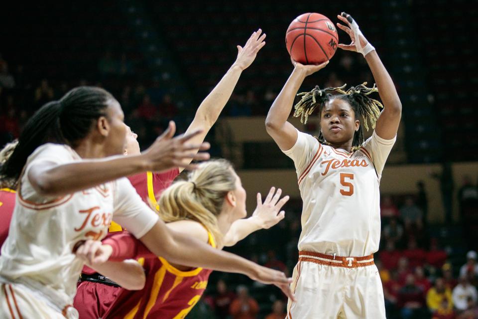 Texas forward DeYona Gaston, right, puts up a shot during a game last season at Iowa State. Gaston is expected to pick up the slack as Texas waits for Taylor Jones to return from an injury.