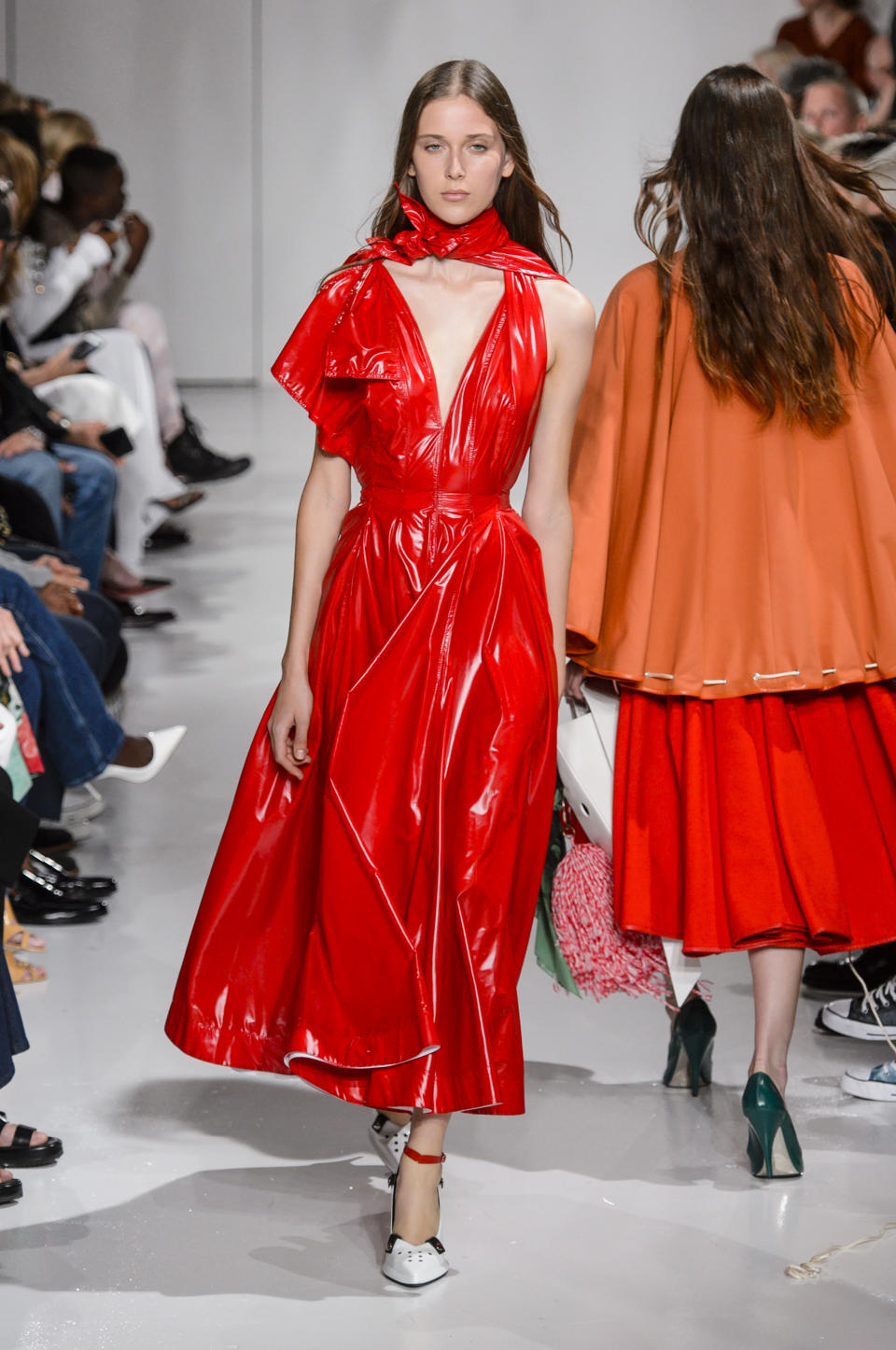 <p><i>Model wears a red patent-leather dress from the Calvin Klein SS18 collection. (Photo: IMAXtree) </i></p>