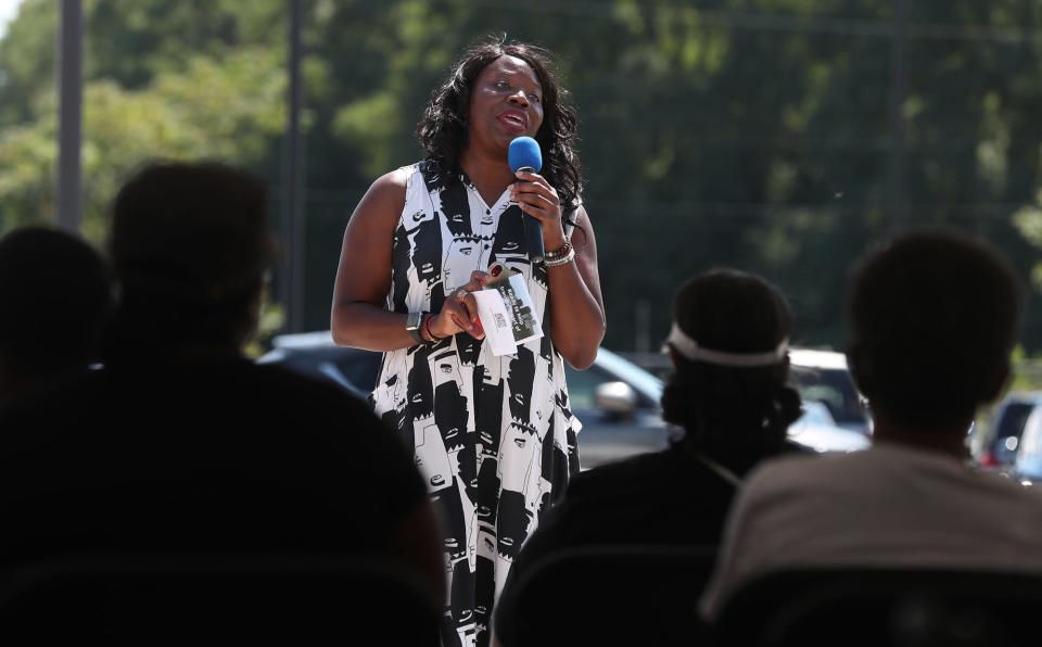 Liz Ogbu, a consultant hired by the city, talks to attendees at the Innerbelt Reunion at the Akron Urban League in Akron on Sunday.