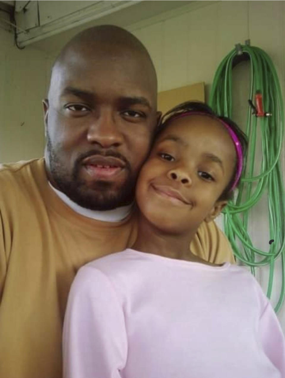 In this photo provided by Ray Montgomery, Six-year-old Jazzmen Montgomery sits next to her father, Ray Montgomery, in 2009. Texas inmate Gary Green is facing execution Tuesday, March 7, 2023, for drowning Jazzmen and fatally stabbing her mother, Lovetta Armstead, his estranged wife, in 2009. (Ray Montgomery via AP)