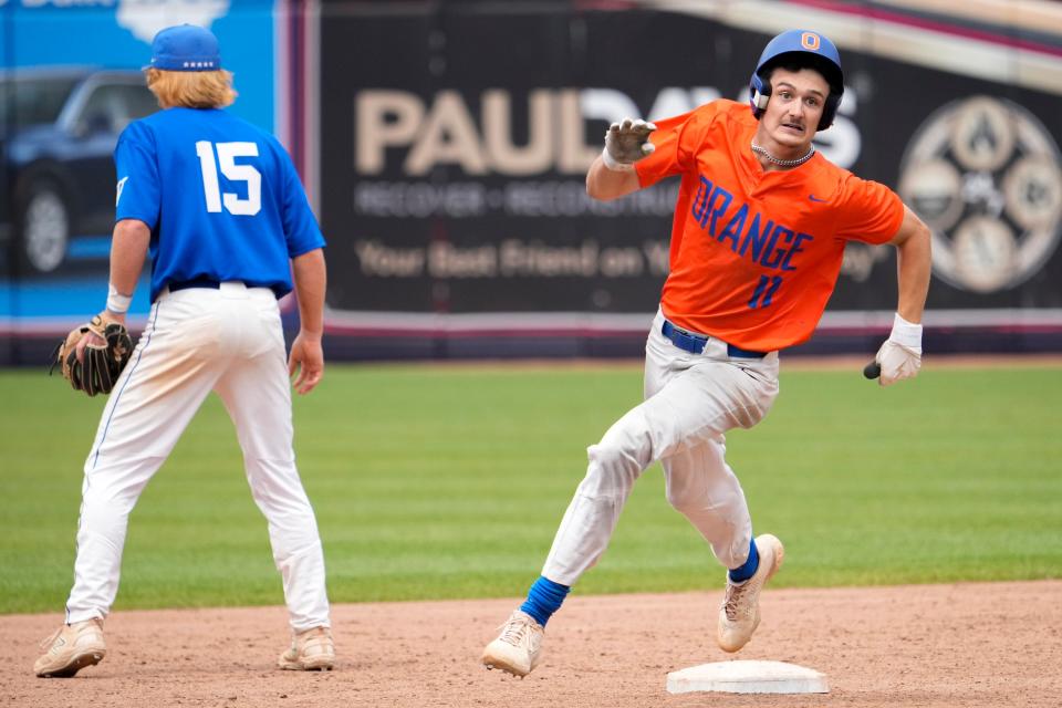 Olentangy Orange's Cole Cahill charges around second base on his way to a ninth-inning triple.