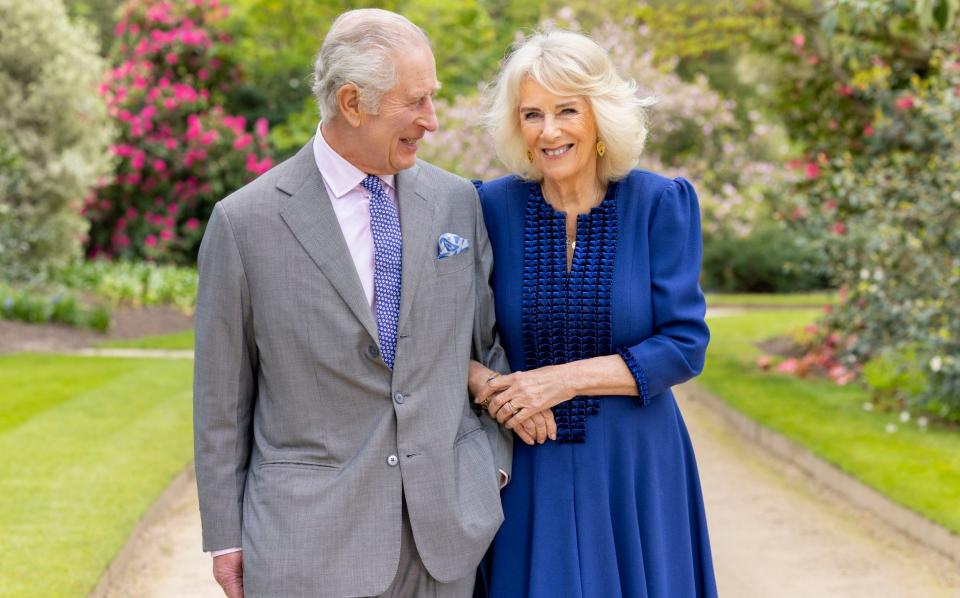 A newly issued picture shows the King and Queen walking arm-in-arm in the Buckingham Palace garden on their 19th wedding anniversary earlier this month