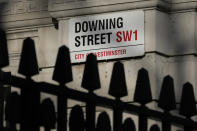 FILE - The street sign at Downing Street in London, Jan. 17, 2022. Fighting for his career, British Prime Minister Boris Johnson has one constant refrain: Wait for Sue Gray. Gray is a senior civil servant who may hold Johnson’s political future in her hands. She has the job of investigating allegations that the prime minister and his staff attended lockdown-flouting parties on government property. (AP Photo/Kirsty Wigglesworth, File)
