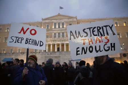 Protesters take part in an anti-austerity pro-government demonstration in front of the parliament in Athens February 11, 2015. REUTERS/Yannis Behrakis