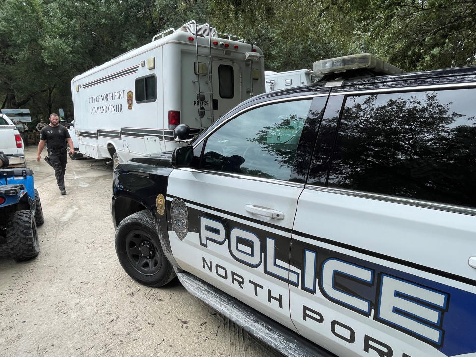 In this photo provided by North Port Police Department, law enforcement officials conduct a search of the vast Carlton Reserve in the Sarasota, Fla., area for Brian Laundrie on Saturday, Sept. 18, 2021. Laundrie is a person of interest in the disappearance of his girlfriend, Gabrielle “Gabby” Petito. (North Port Police Department via AP)