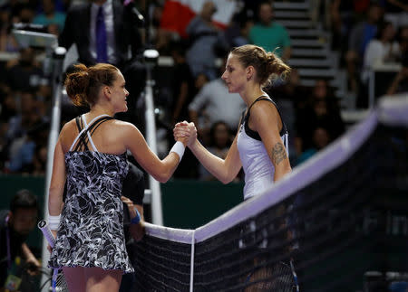 Agnieszka Radwanska of Poland is congratulated by Karolina Pliskova of the Czech Republic. Singapore WTA Finals Round Robin Singles - Singapore Indoor Stadium, Singapore - 28/10/2016. REUTERS/Edgar Su