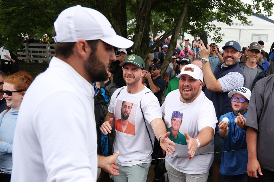 LOUISVILLE, KENTUCKY - MAY 17: Scottie Scheffler of the United States shakes hands with fans wearing Scottie Scheffler t-shirts as he walks off the ninth green during the second round of the 2024 PGA Championship at Valhalla Golf Club on May 17, 2024 in Louisville, Kentucky. (Photo by Patrick Smith/Getty Images)