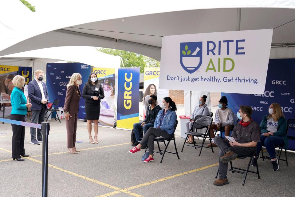 First Lady Jill Biden (C) tours the vaccination clinic with Yasheka Sharma of Rite Aid (R), Grand Rapids Mayor Rosalynn Bliss (L), and Rep. Peter Meijer, R-Michigan (2nd L), at Grand Rapids Community College's downtown campus in Grand Rapids, Michigan, on May 27, 2021. (Photo by Carolyn Kaster / POOL / AFP) (Photo by CAROLYN KASTER/POOL/AFP via Getty Images)