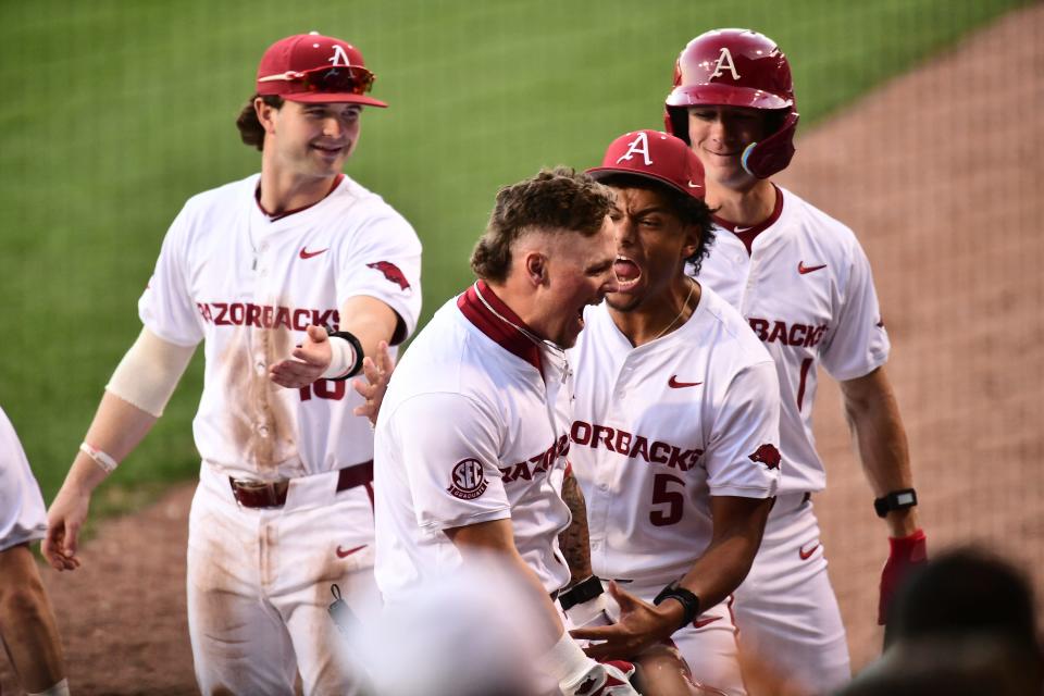 Arkansas baseball's Jack Wagner approaches the dugout and celebrates a home run against LSU Thursday, March 28, 2024.