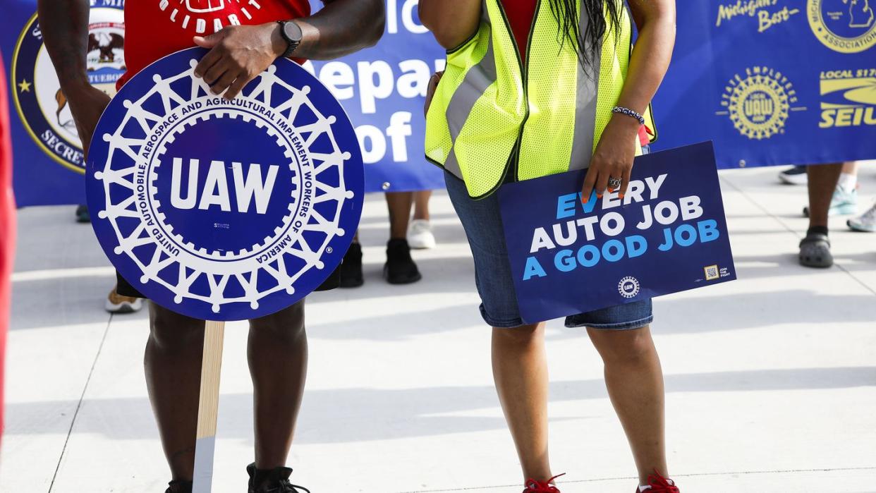 united auto workers members march in detroit labor day parade