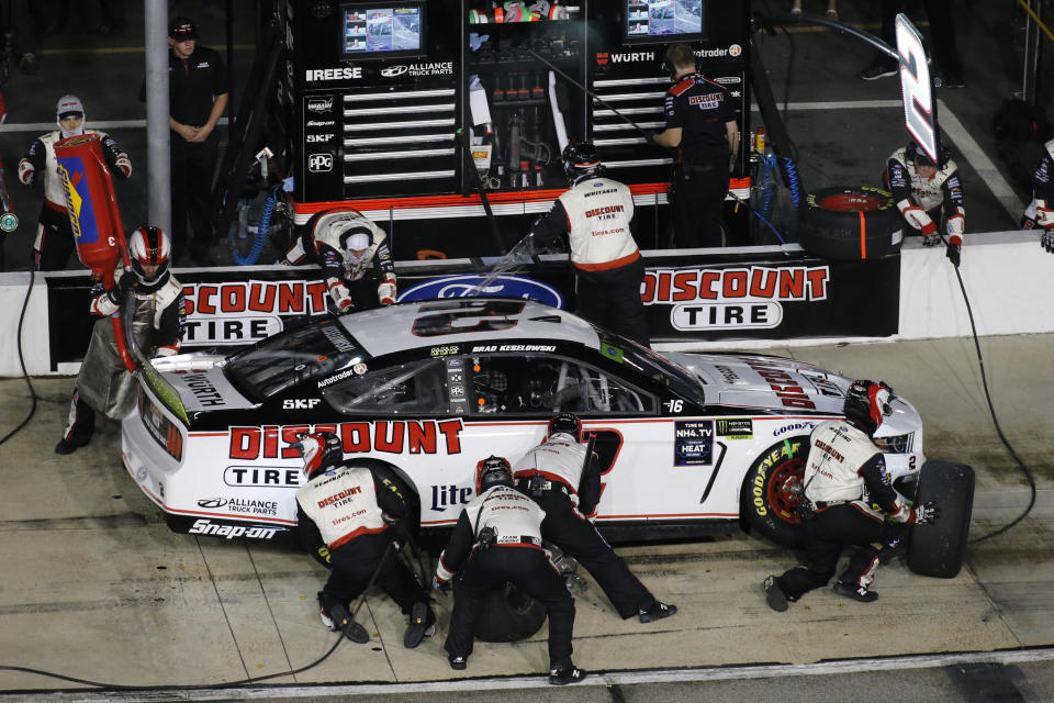 Brad Keselowski makes a pit stop during the NASCAR Cup Series auto race at Richmond Raceway in Richmond, Va., Saturday, Sept. 21, 2019. (AP Photo/Steve Helber)