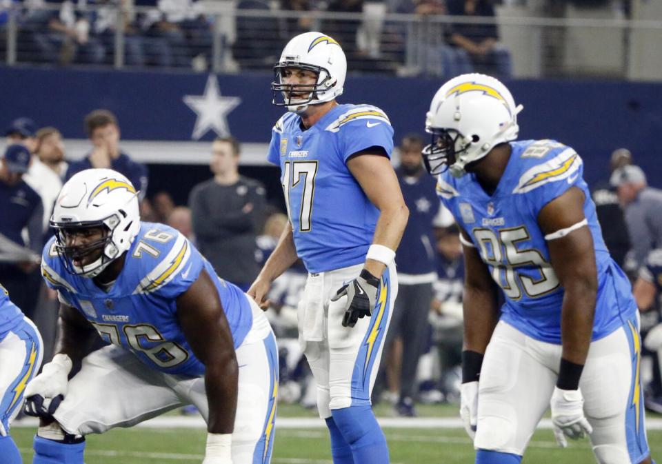 Chargers quarterback Philip Rivers (17) calls signals with tight end Antonio Gates (85) lined up outside the tackle.