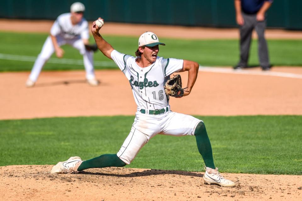 Olivet's Ramsey Bousseau pitches to an Okemos batter during the fourth inning on Wednesday, May 31, 2023, at McLane Stadium on the Michigan State campus in East Lansing.