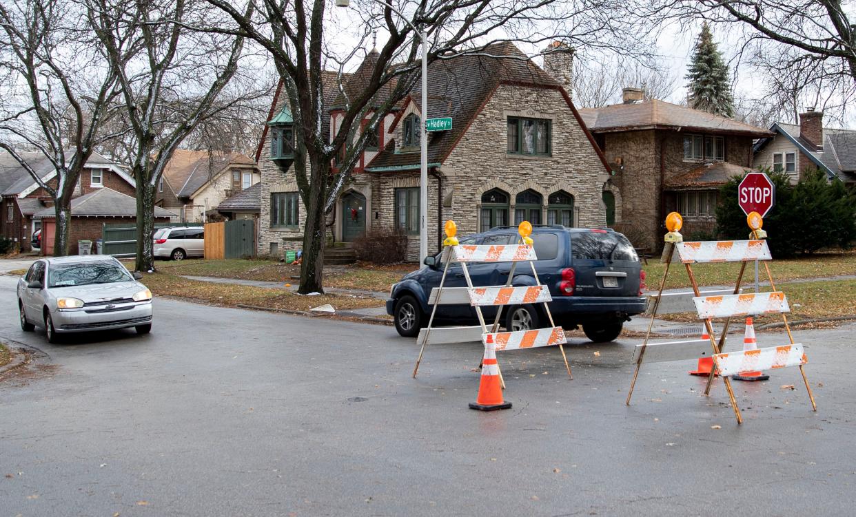 Vehicles on Saturday slow down to go around a makeshift traffic circle at North Grant Boulevard and West Hadley Street constructed by a resident fed up with seeing reckless driving in his Sherman Park Milwaukee neighborhood.