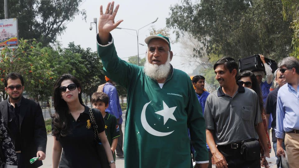 Chaudhry Abdul Jalil, popularly known as Chacha Cricket, waves after crossing the India-Pakistan border in Wagah on March 29, 2011, on the eve of the India-Pakistan Cricket World Cup semi-final match. - Narinder Nanu/AFP/Getty Images