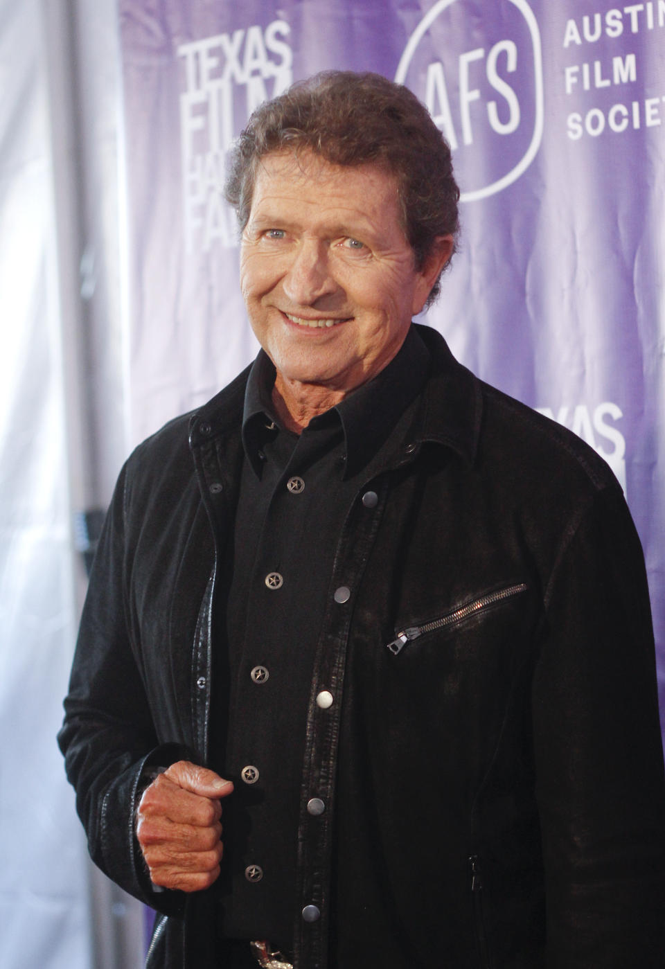 FILE - Musician Mac Davis appears at the Texas Film Awards in Austin, Texas on March 6, 2014. Davis, a country star and Elvis songwriter, died on Tuesday, Sept. 29, 2020 after heart surgery. He was 78. Davis started his career writing hits for Presley, including “A Little Less Conversation” and “In the Ghetto.” The Lubbock, Texas-native had a varied career over the years as a singer, actor and TV host and was inducted into the Songwriters Hall of Fame in 2006. He was named ACM entertainer of the year in 1974 after the success of songs like “Baby Don't Get Hooked on Me.” (Photo by Jack Plunkett/Invision/AP, File)