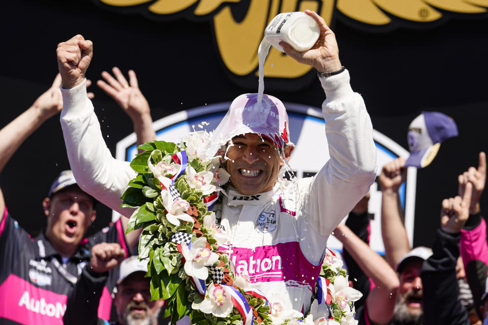 FILE - Helio Castroneves of Brazil celebrates after winning the Indianapolis 500 auto race at Indianapolis Motor Speedway in Indianapolis, Sunday, May 30, 2021. (AP Photo/Michael Conroy)