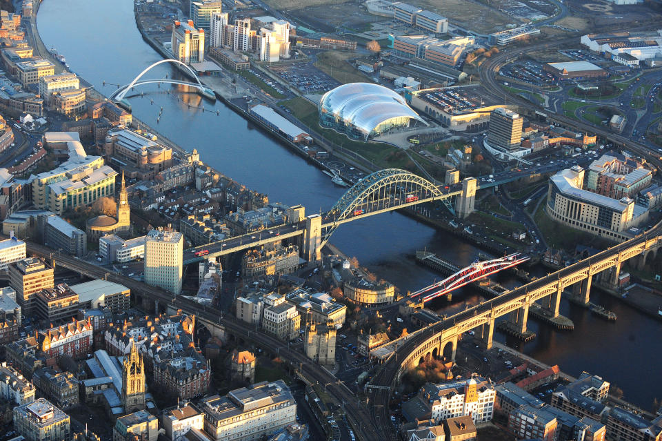 Aerial view of Newcastle city centre showing the Tyne Bridge, the Gateshead Millennium Bridge (also know as the 'Blinking Eye Bridge'), The Baltic Arts Centre and the Sage Gateshead music centre.