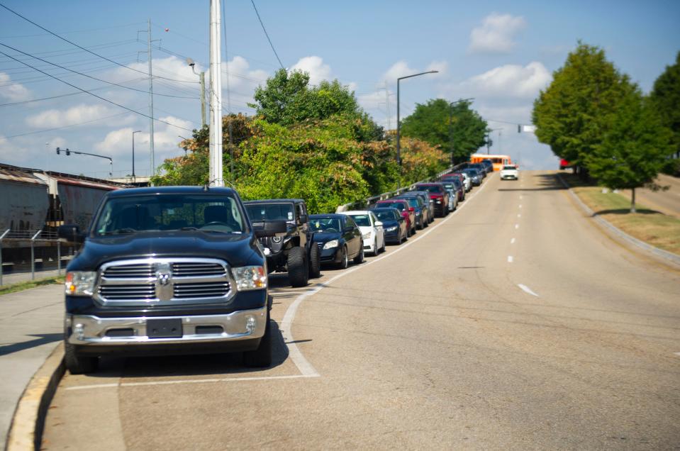 A line of cars parked on the side of Volunteer Boulevard at the University of Tennessee at Knoxville on September 27, 2023.