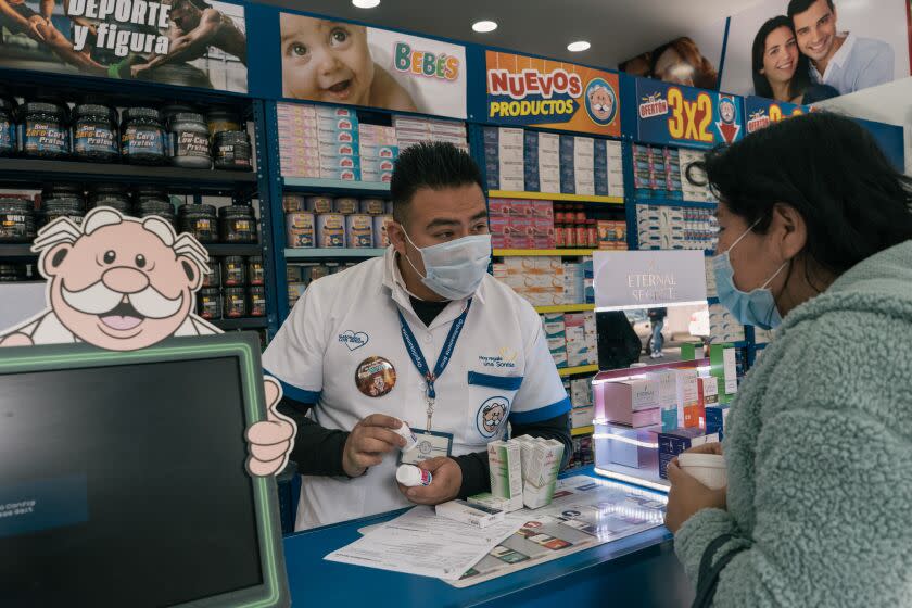 MEXICO CITY, MEXICO, DECEMBER 2, 2022: Adrian Ramirez Gonzalez sells flu medicine to Carmen Maldonado, a regular costumer and patient at the first Similares Pharmacy, opened since 1997. Carmen Maldonado and her family have been attending to the pharmacy for years due to the lack of quality services in the public health system and the elevated prices of private doctors. (Luis Antonio Rojas / For The Times)