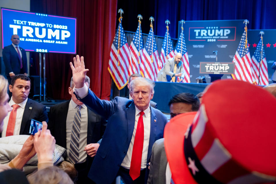 Former President Donald Trump greets supporters after a campaign stop in Davenport, Monday, March 13, 2023. 