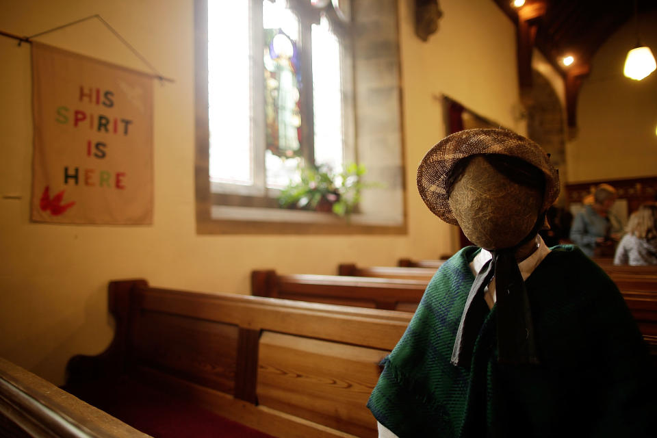 Scarecrows sit in the pews of St Mary's church as part of the annual scarecrow festival on August 13, 2011 in Kettlewell, England.