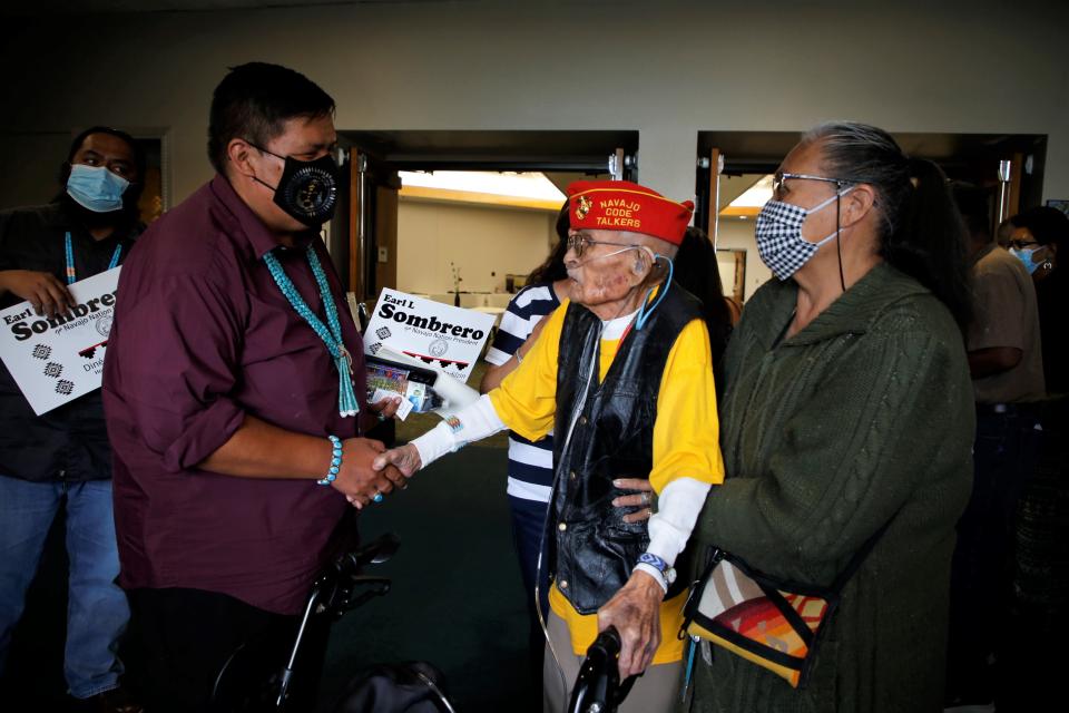 Navajo Nation presidential candidate Earl L. Sombrero, left, meets with Navajo Code Talker Samuel Sandoval after the presidential candidate forum on June 3 at San Juan College in Farmington.