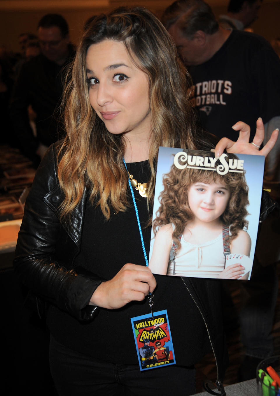 Alisan Porter holds a picture of herself as Curly Sue in 2015