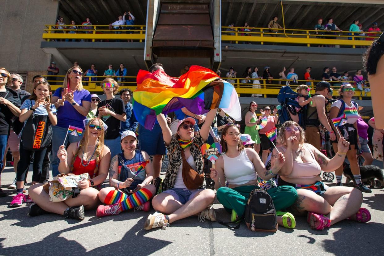 Canada's Pride season is underway. Winnipeg has already held its Pride parade. The image above shows attendees at the parade, which was held in the Manitoba capital on June 2. The timing of local celebrations varies based on history, weather and scheduling. (Daniel Crump/The Canadian Press - image credit)
