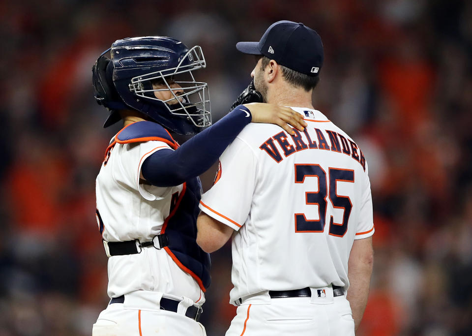 HOUSTON, TEXAS - OCTOBER 29:  Justin Verlander #35 of the Houston Astros gets a mound visit from Robinson Chirinos #28 against the Washington Nationals during the fourth inning in Game Six of the 2019 World Series at Minute Maid Park on October 29, 2019 in Houston, Texas. (Photo by Elsa/Getty Images)