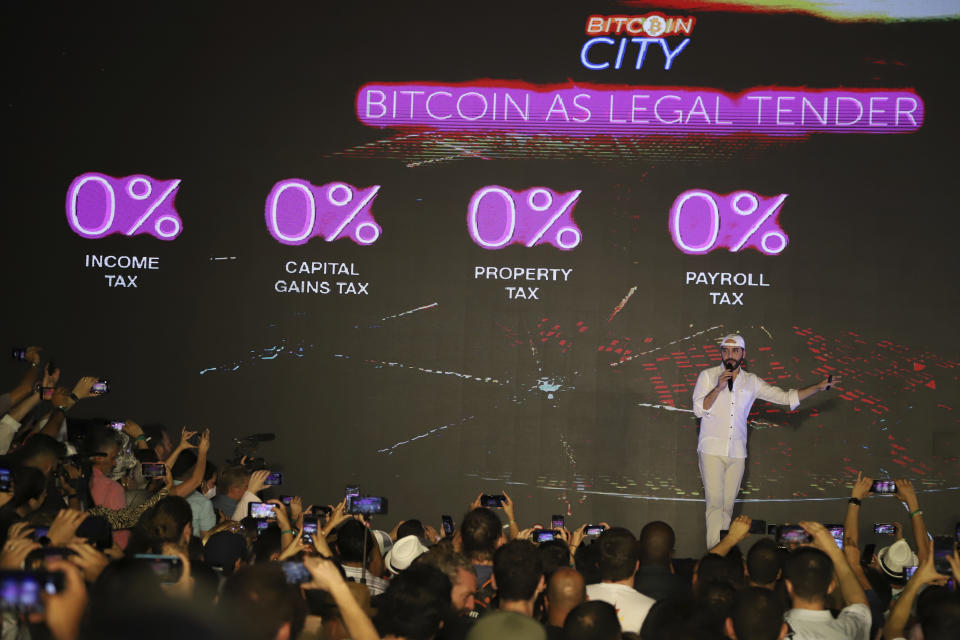 El Salvador's President Nayib Bukele participates in the closing ceremony of a congress for cryptocurrency investors in Santa Maria Mizata, El Salvador, Saturday, Nov. 20, 2021. Bukele announced during the rock concert-like atmosphere at the gathering that his government will build an oceanside "Bitcoin City" at the base of a volcano. (AP Photo/Salvador Melendez)