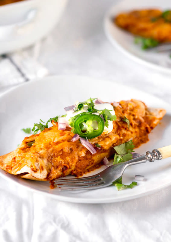 <p>The Pure Taste</p><p>Extremely easy to make, this rotisserie chicken enchilada recipe is a healthier alternative to takeouts.</p><p><strong>Get the recipe: <a href="https://thepuretaste.com/rotisserie-chicken-enchiladas/" rel="nofollow noopener" target="_blank" data-ylk="slk:Rotisserie Chicken Enchiladas;elm:context_link;itc:0;sec:content-canvas" class="link ">Rotisserie Chicken Enchiladas</a></strong></p>