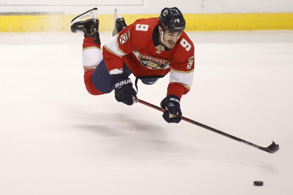 Florida Panthers' Brian Boyle reaches for the puck during the first period of the team's NHL hockey game against the Dallas Stars, Friday, Dec. 20, 2019, in Sunrise, Fla. (AP Photo/Luis M. Alvarez)