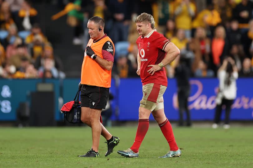 Aaron Wainwright of Wales with medical staff at the end of the game