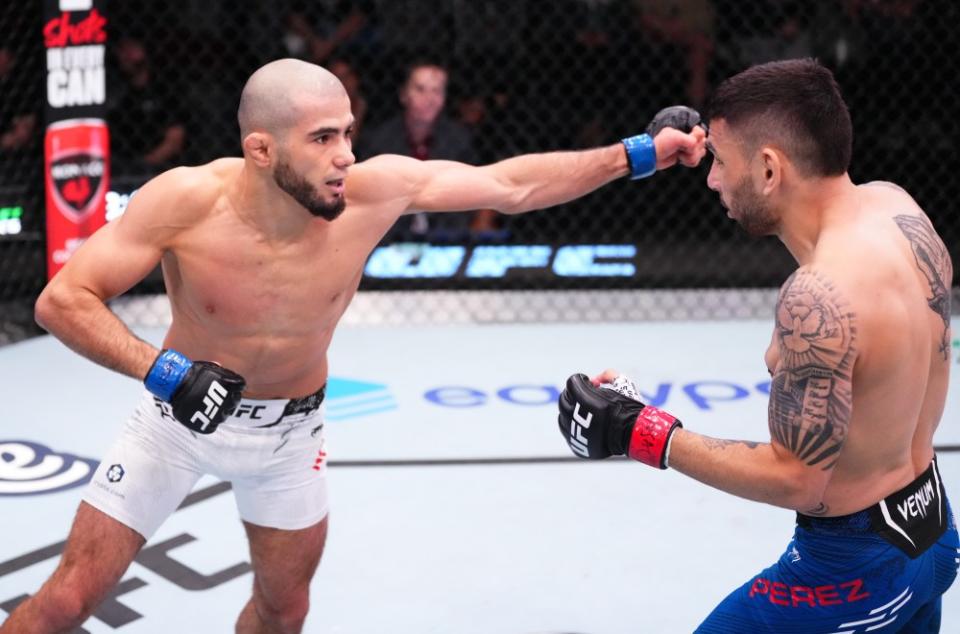 LAS VEGAS, NEVADA – MARCH 02: (L-R) Muhammad Mokaev of Russia punches Alex Perez in a flyweight bout during the UFC Fight Night event at UFC APEX on March 02, 2024 in Las Vegas, Nevada. (Photo by Jeff Bottari/Zuffa LLC via Getty Images)