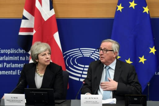 British Prime Minister Theresa May held last-ditch talks with European Commission President Jean-Claude Juncker ahead of a vote in parliament on their Brexit deal